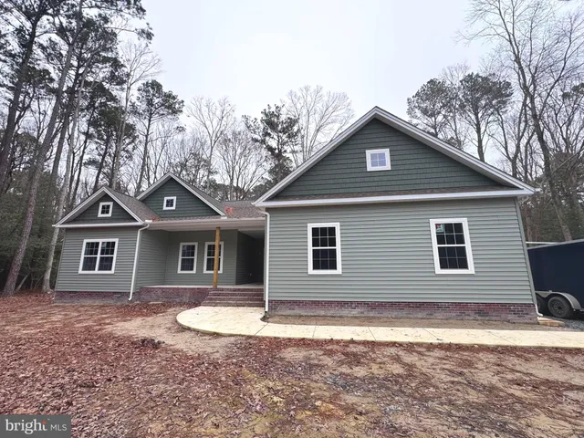 a front view of a house with yard