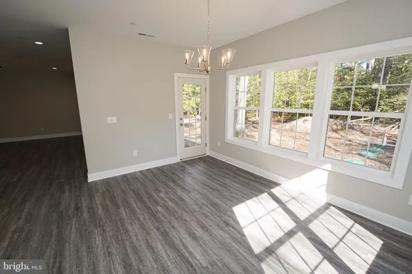 a white bath tub sitting in a bathroom