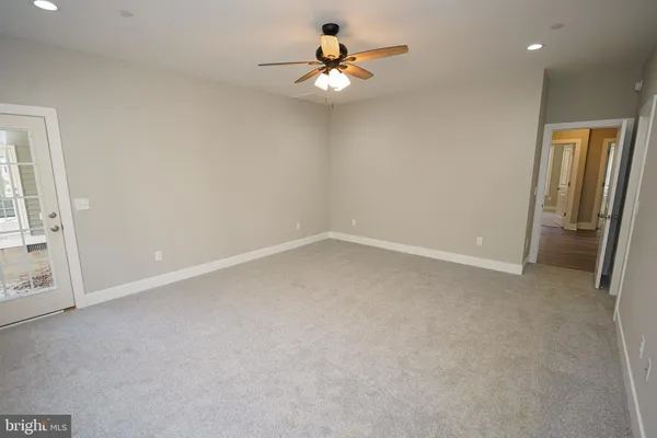a view of an empty room and closet area