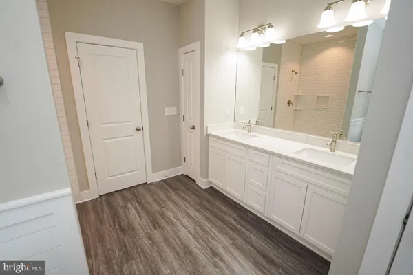 a view of a dry yard with lots of bushes