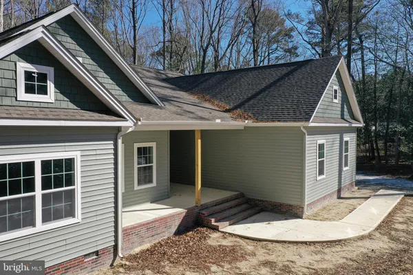 a kitchen with a sink a stove top oven and white stainless steel appliances