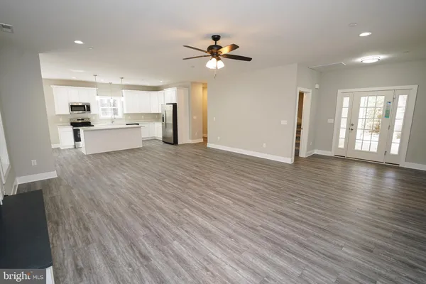 a view of room with wooden floor