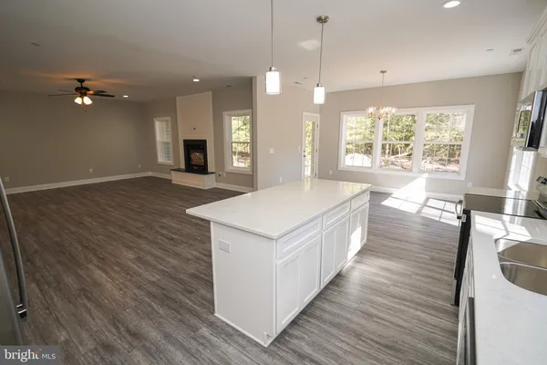 a bathroom with a sink a mirror and a toilet