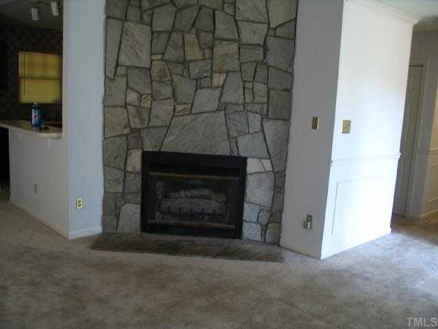 2221 Carthage Circle Raleigh, NC 27604 - Photo 3 of 6 a room with a fireplace