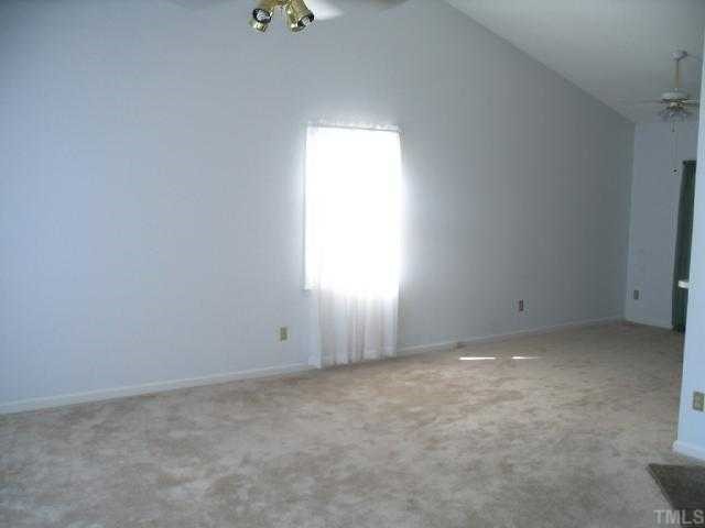 2221 Carthage Circle Raleigh, NC 27604 - Photo 4 of 6 an empty room with a window