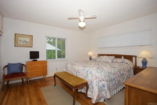 a bedroom with two beds and a couch