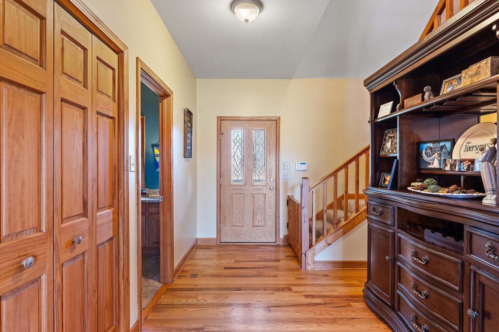 26930 South State Line Road Crete, IL 60417 - Photo 10 of 60 a view of a hallway with wooden floor and staircase