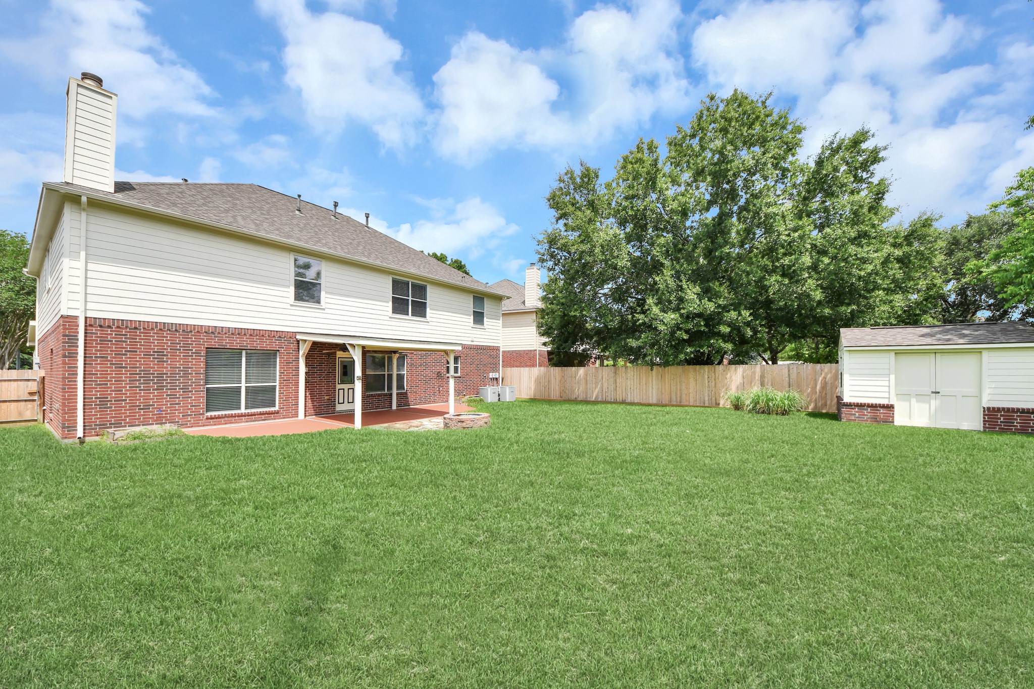 7622 McCormick Mill Court Houston, TX 77095 - Photo 34 of 37 a view of a house with backyard and garden