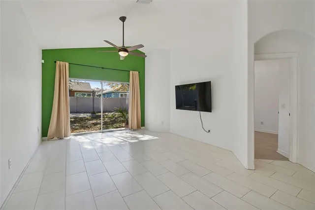a view of an empty room with glass door