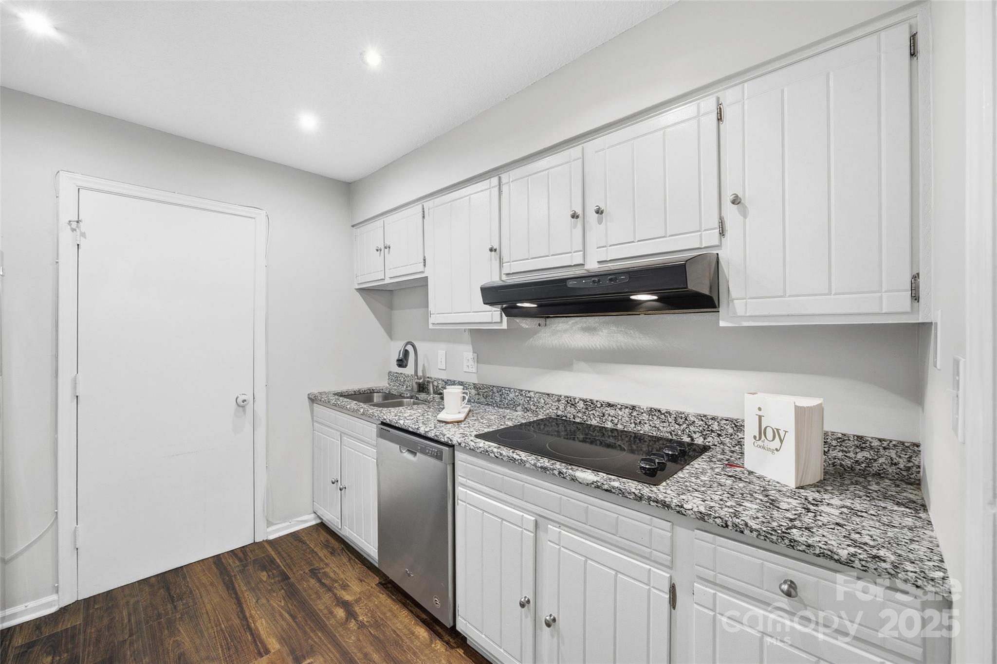 4739 Hedgemore Drive, Unit O Charlotte, NC 28209 - Photo 8 of 25 a kitchen with a sink and cabinets