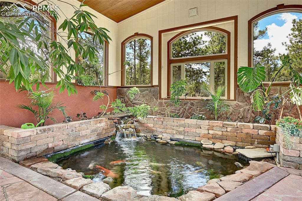 17350 Goshawk Road Colorado Springs, CO 80908 - Photo 34 of 50 a swimming pool with outdoor seating