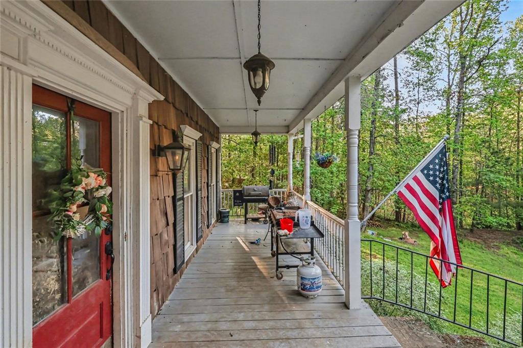 1940 Honey Creek Road Southwest Conyers, GA 30094 - Photo 26 of 31 a view of a porch with furniture and garden