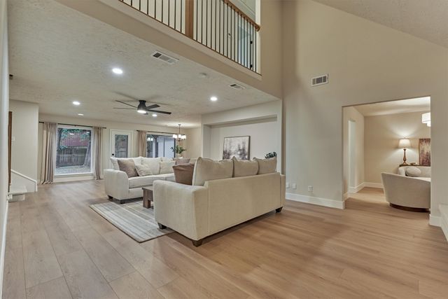 a bathroom with a double vanity sink mirror and shower