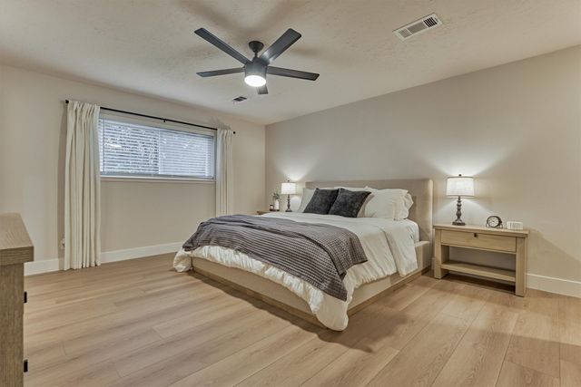 a dining hall with stainless steel appliances granite countertop furniture fireplace and wooden floor