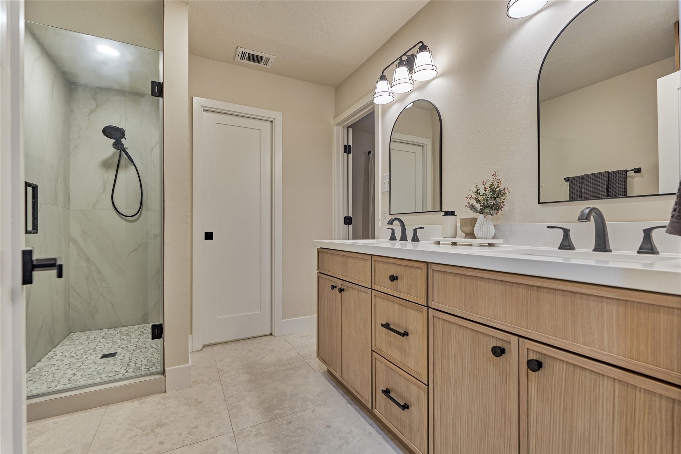 27286 Jimmy Lane Conroe, TX 77385 - Photo 24 of 50 Stunning! Spa-like primary bathroom features a raised vanity with double sinks, walk-in shower, and commode closet.
