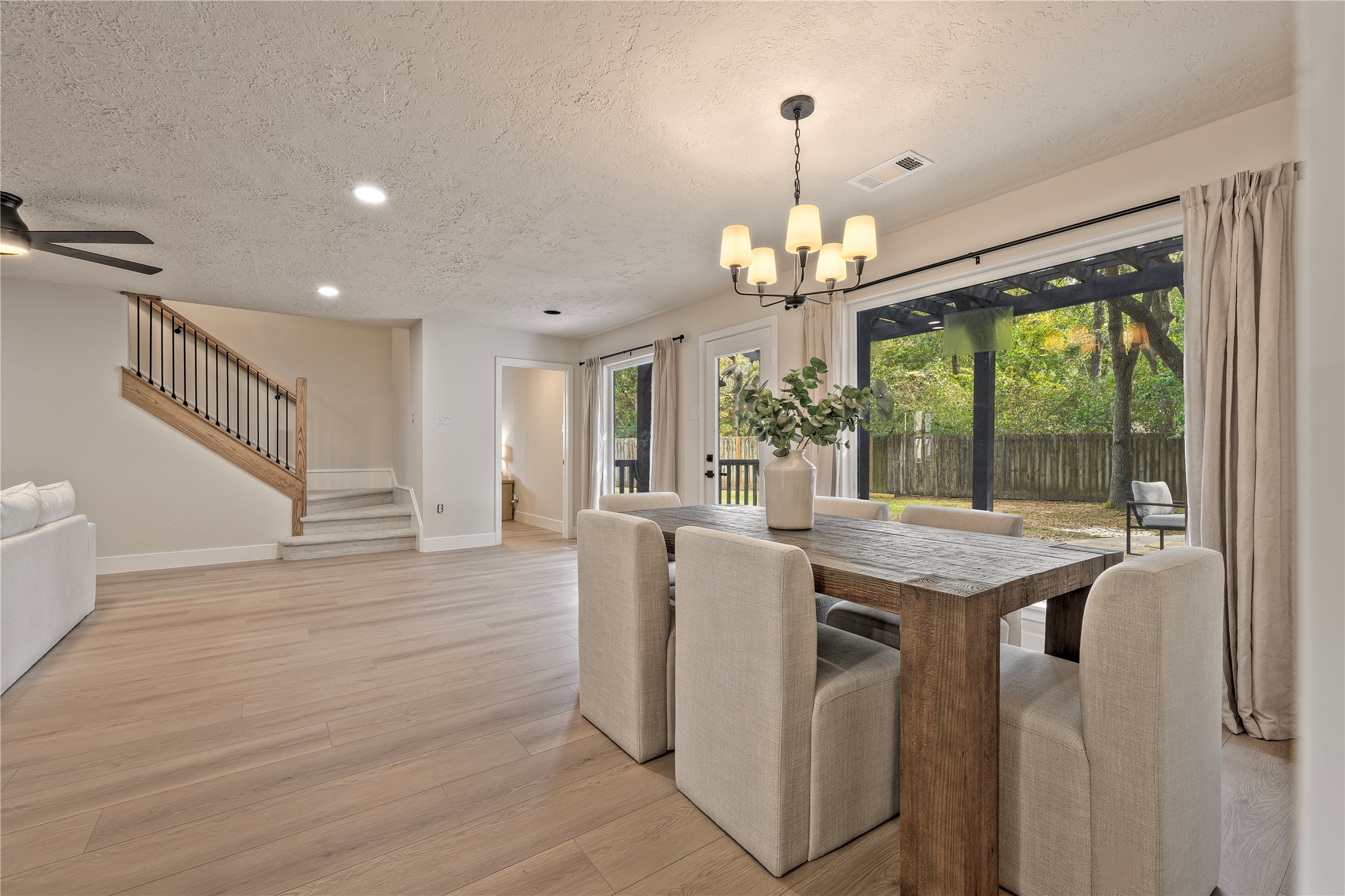 27286 Jimmy Lane Conroe, TX 77385 - Photo 28 of 50 You’ll love the openness of this great room, featuring a wall of windows overlooking the private backyard — perfect for indoor/outdoor entertaining!