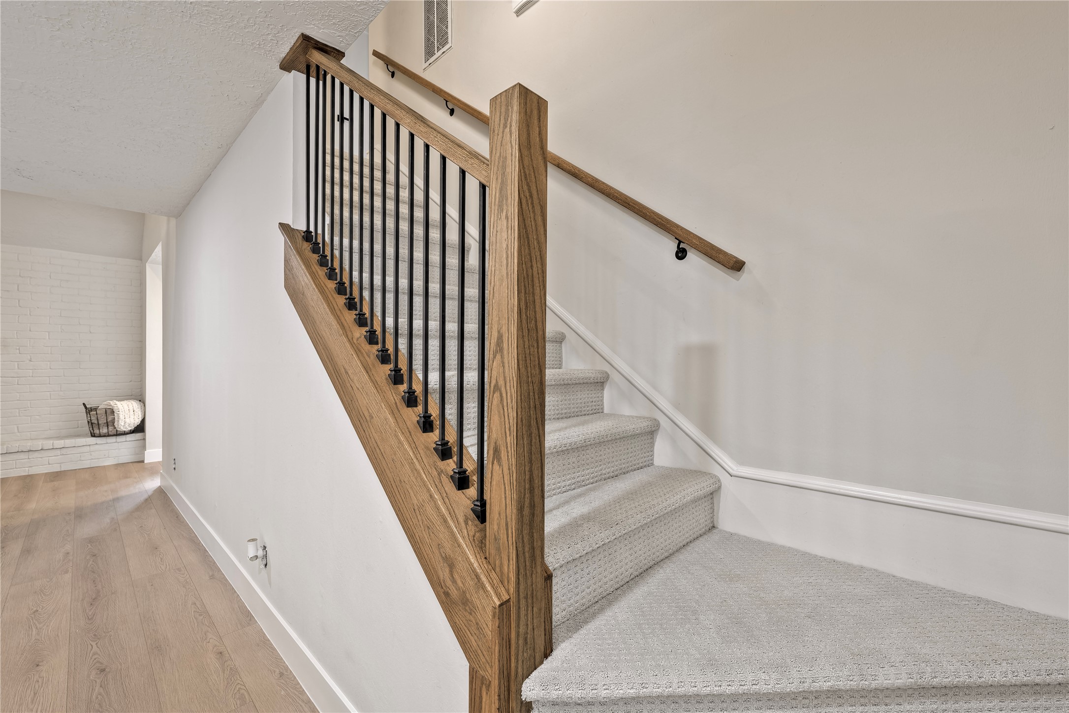 27286 Jimmy Lane Conroe, TX 77385 - Photo 29 of 50 Updated stairway with NEW carpet, wooden handrail, and iron balusters.