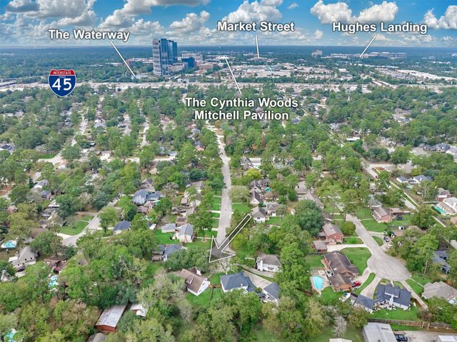a view of a house with potted plants