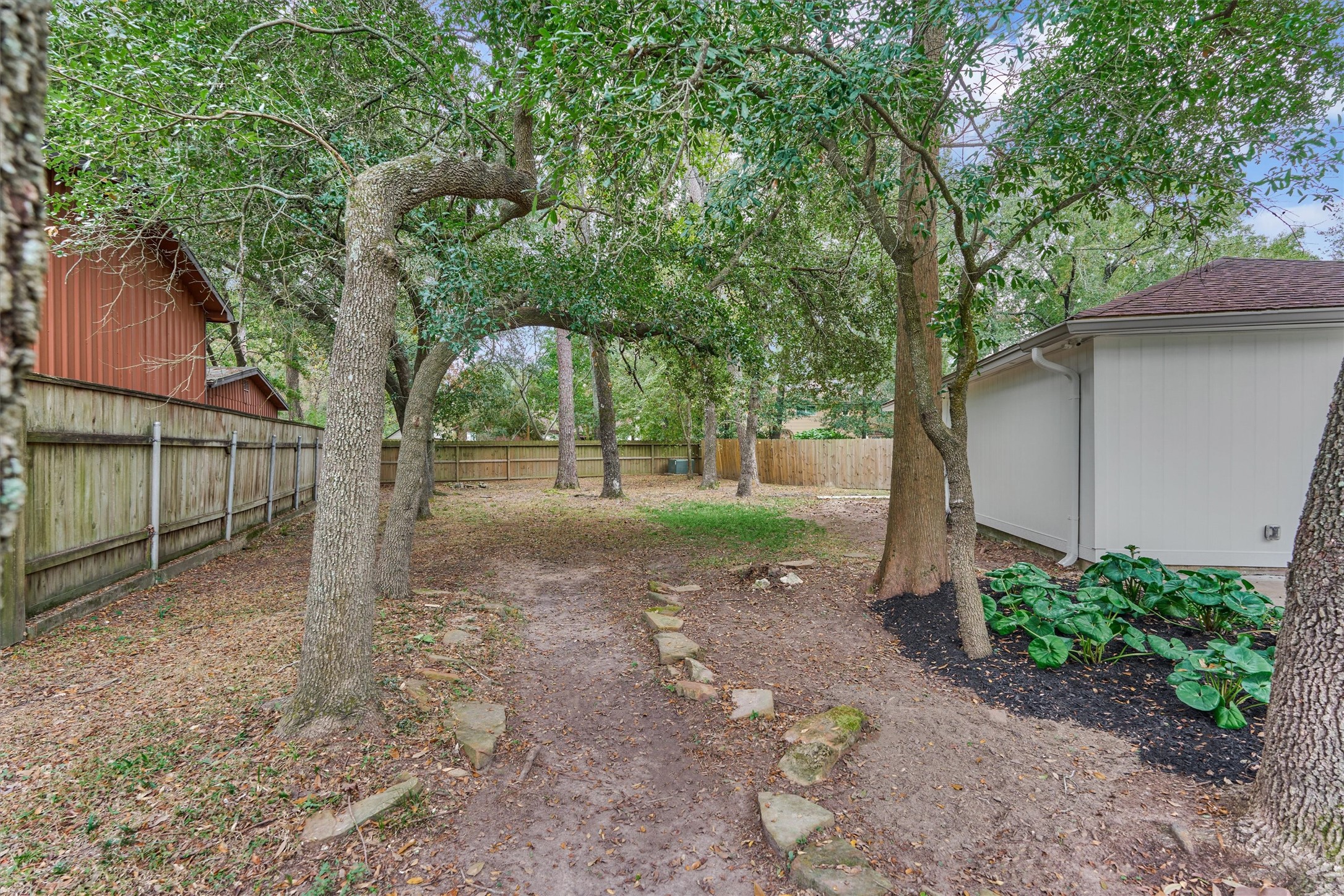 27286 Jimmy Lane Conroe, TX 77385 - Photo 44 of 50 Bring all your playground equipment or plant a garden — the possibilities are endless with this spacious, private backyard!
