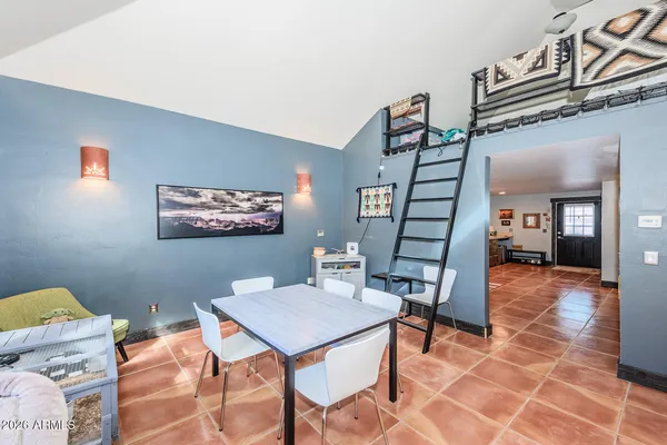 a view of a livingroom with furniture and a window