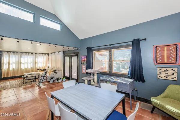 a bedroom with a bed and lamp