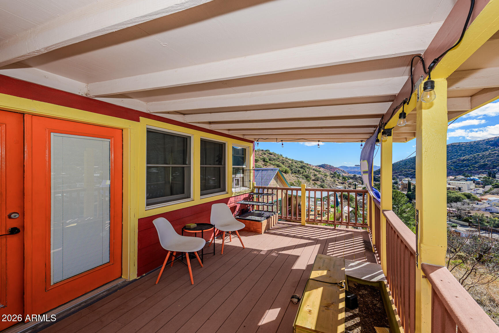 17 G Laundry Hill Road Bisbee, AZ 85603 - Photo 26 of 48 a balcony with wooden floor and outdoor seating