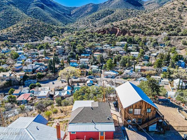an aerial view of residential houses with outdoor space