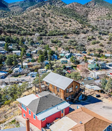 an aerial view of a houses with a outdoor space