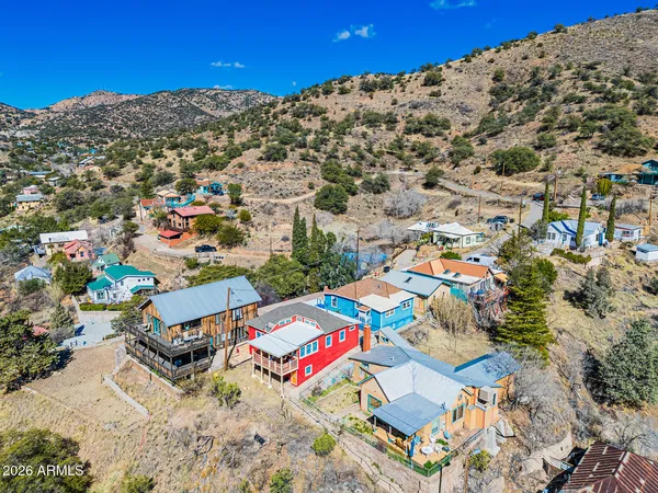 an aerial view of a houses with a road