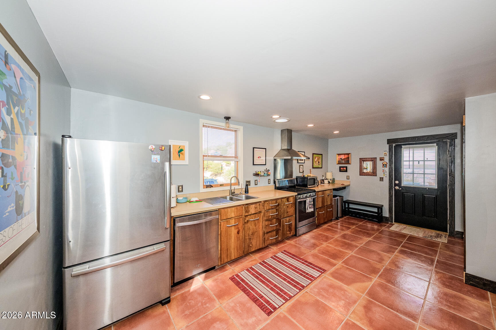 17 G Laundry Hill Road Bisbee, AZ 85603 - Photo 5 of 48 a kitchen with stainless steel appliances granite countertop a refrigerator oven a sink dishwasher and a refrigerator with wooden floor