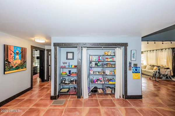 a view of a livingroom with shelves