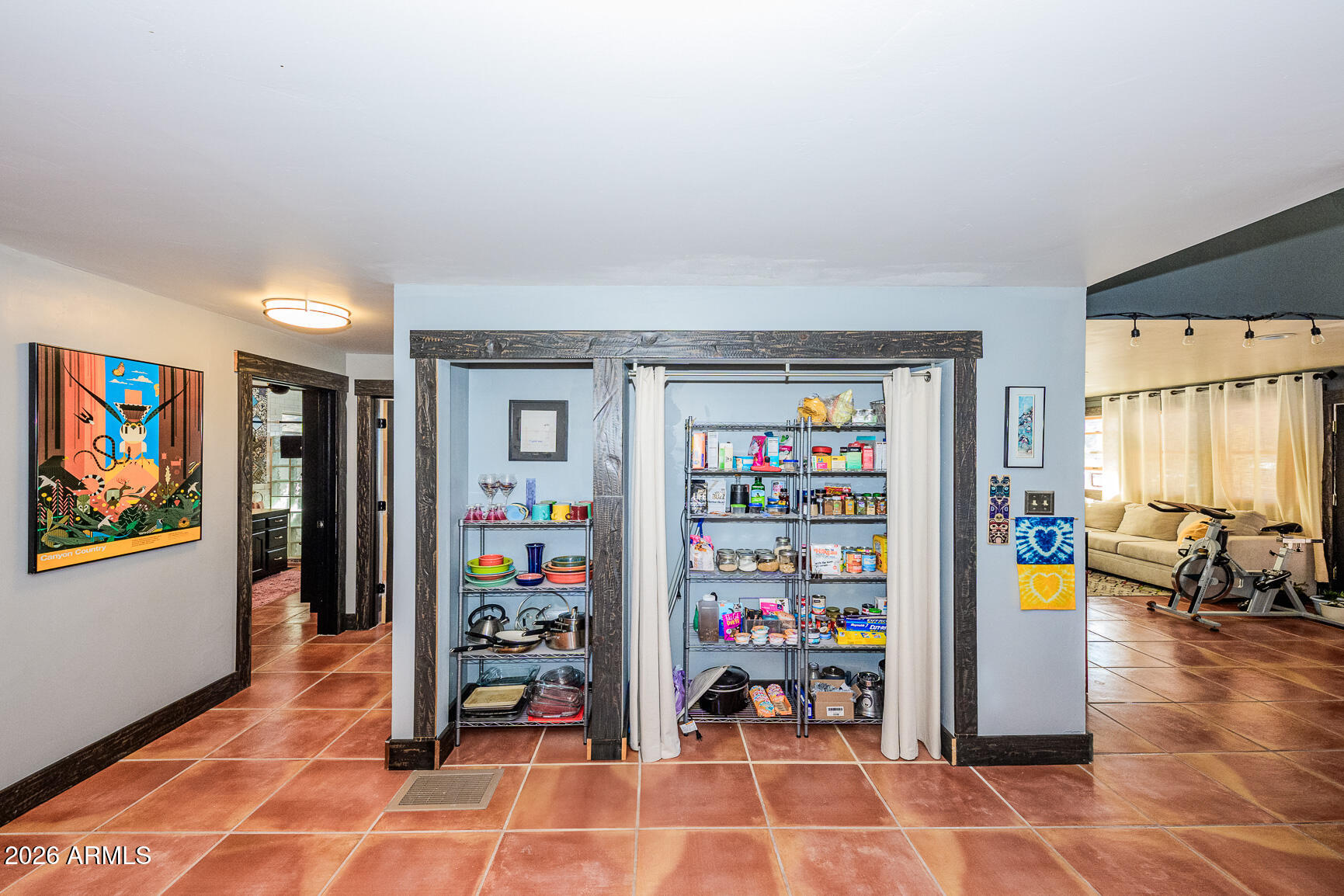 17 G Laundry Hill Road Bisbee, AZ 85603 - Photo 9 of 48 a living room with furniture and a book shelf