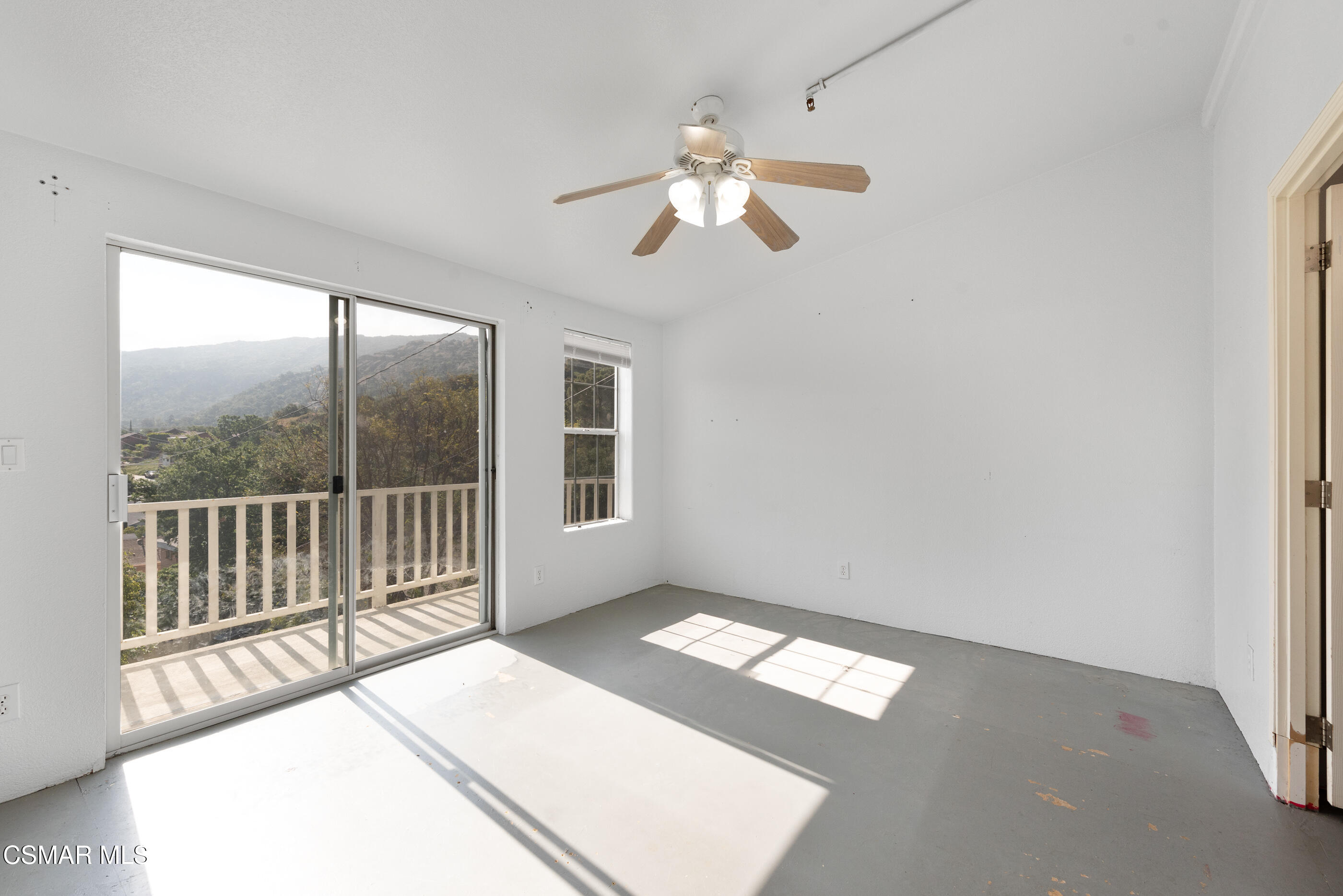 6079 Cedar Street Simi Valley, CA 93063 - Photo 11 of 31 a view of an empty room with a window