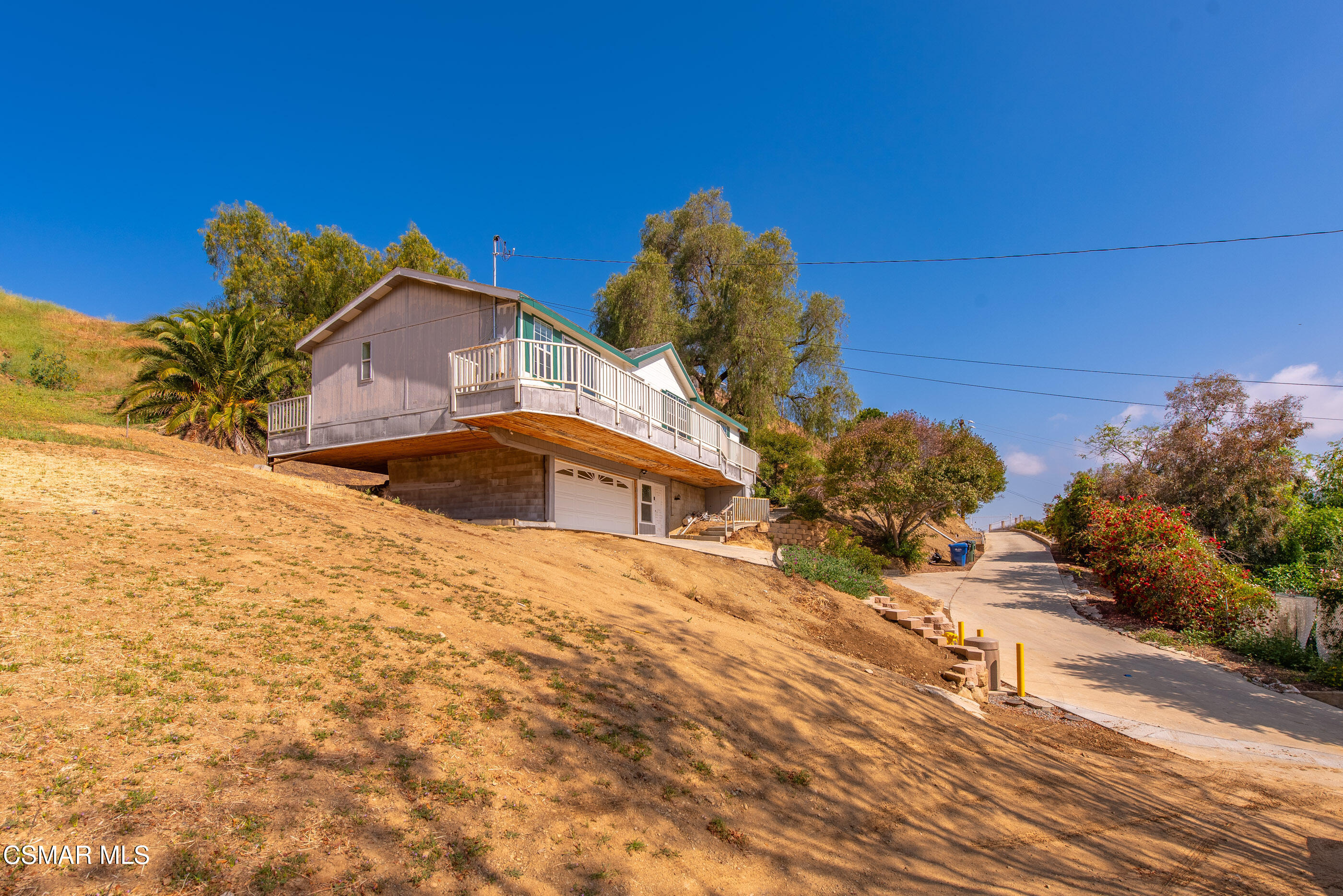 6079 Cedar Street Simi Valley, CA 93063 - Photo 29 of 31 a front view of a house with a yard