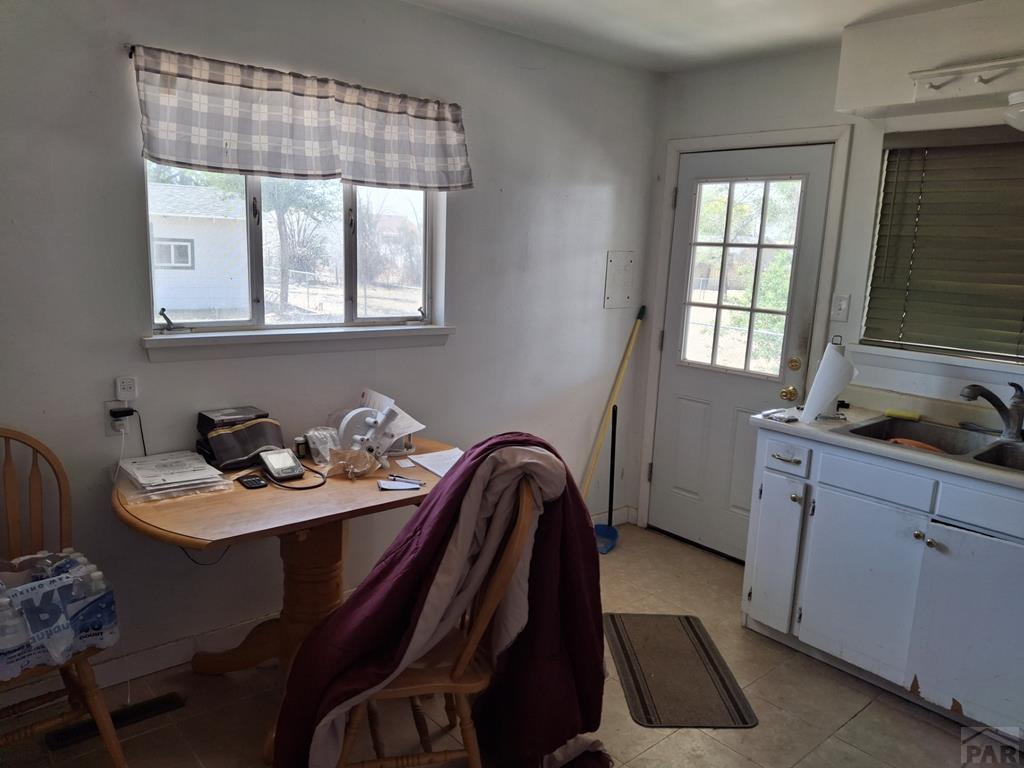 214 3rd Street Fowler, CO 81039 - Photo 5 of 15 a view of a kitchen area with furniture and window