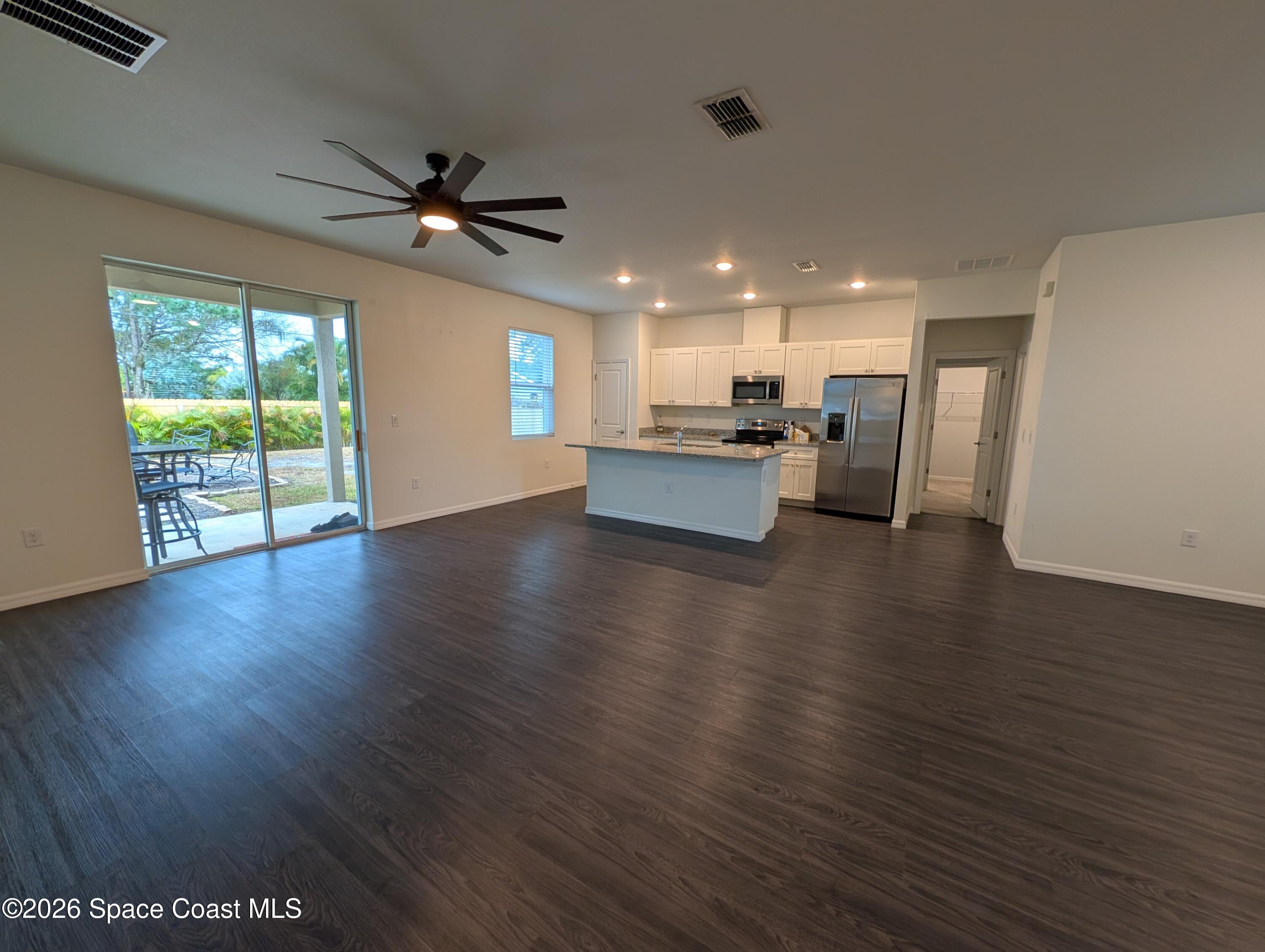 209 Wendover Road Southwest Palm Bay, FL 32908 - Photo 3 of 22 Living room to Kitchen