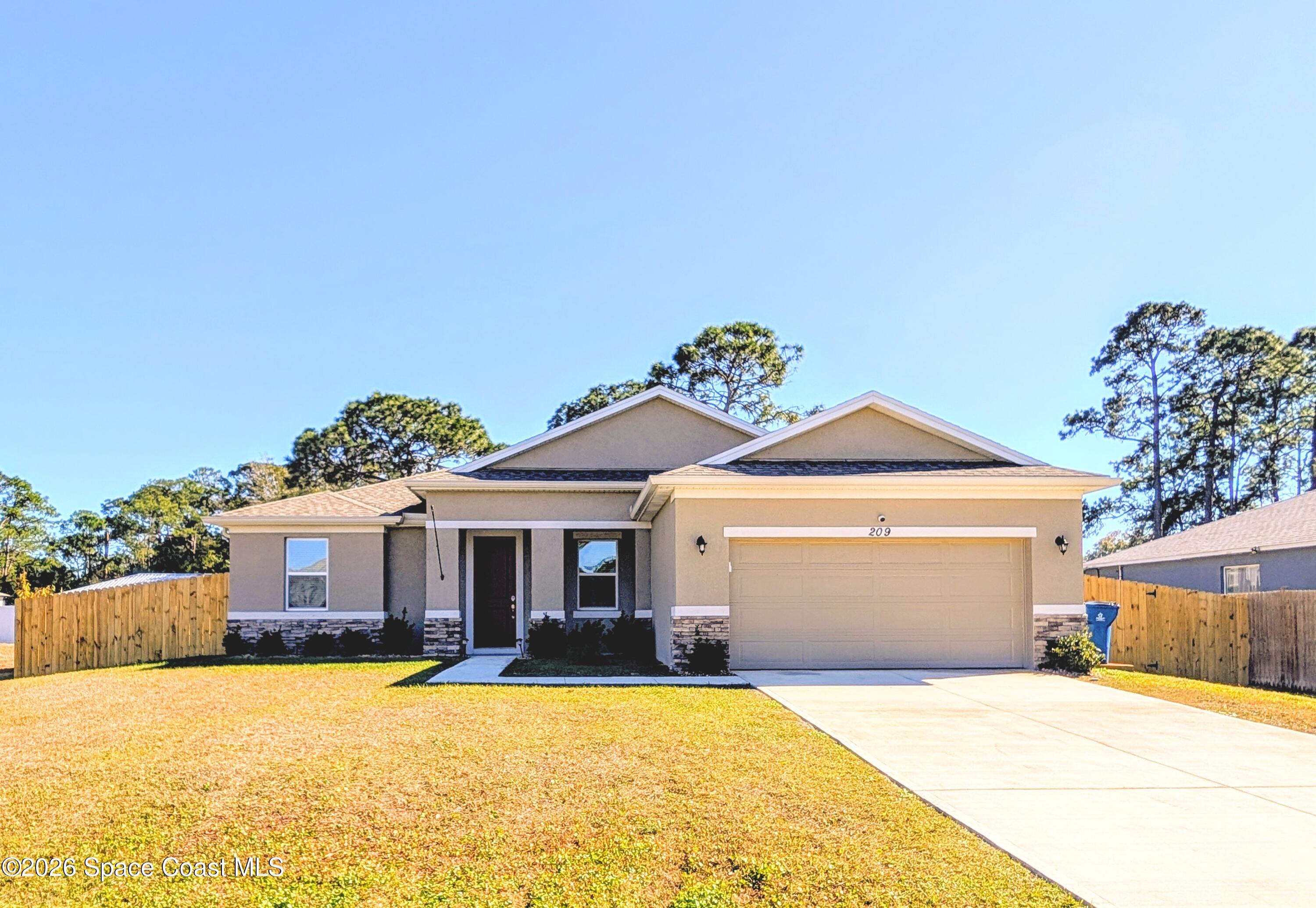 209 Wendover Road Southwest Palm Bay, FL 32908 - Photo 4 of 32 Front of Home