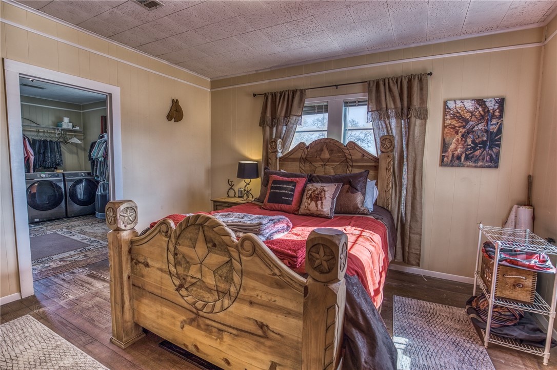 9354 Farm To Market 2780 Burton, TX 77835 - Photo 18 of 43 a bedroom with a bed and wooden floor