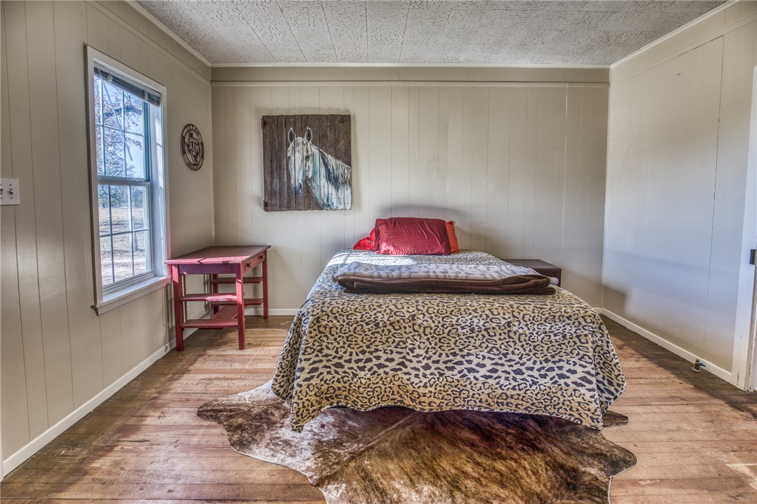 9354 Farm To Market 2780 Burton, TX 77835 - Photo 19 of 43 a bedroom with a bed and a dresser in it