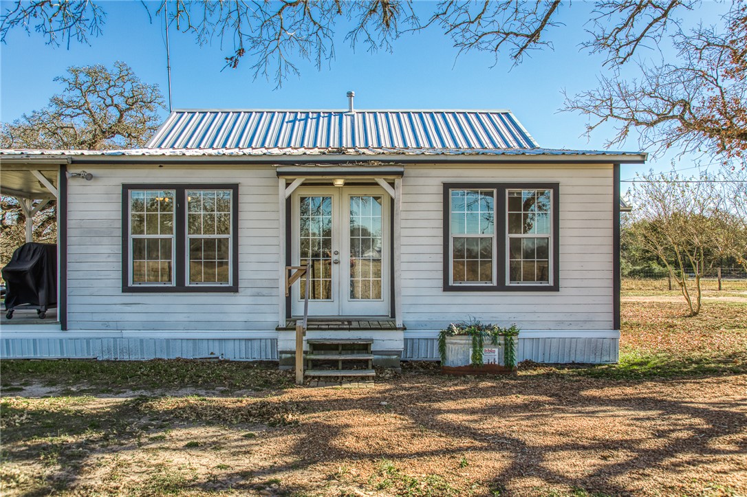 9354 Farm To Market 2780 Burton, TX 77835 - Photo 20 of 43 a front view of a house with a garden