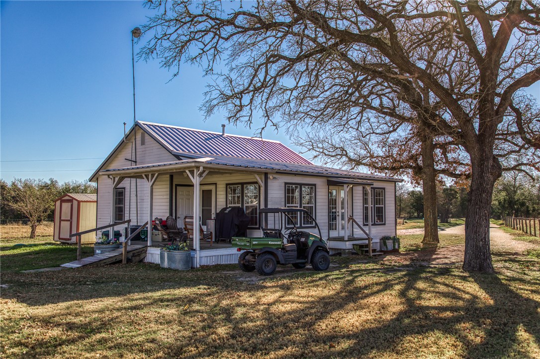 9354 Farm To Market 2780 Burton, TX 77835 - Photo 21 of 43 a view of a house with a yard chairs and floor to ceiling window