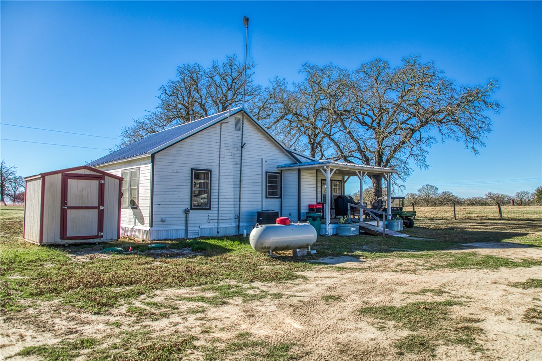 9354 Farm To Market 2780 Burton, TX 77835 - Photo 22 of 43 a front view of a house with garden