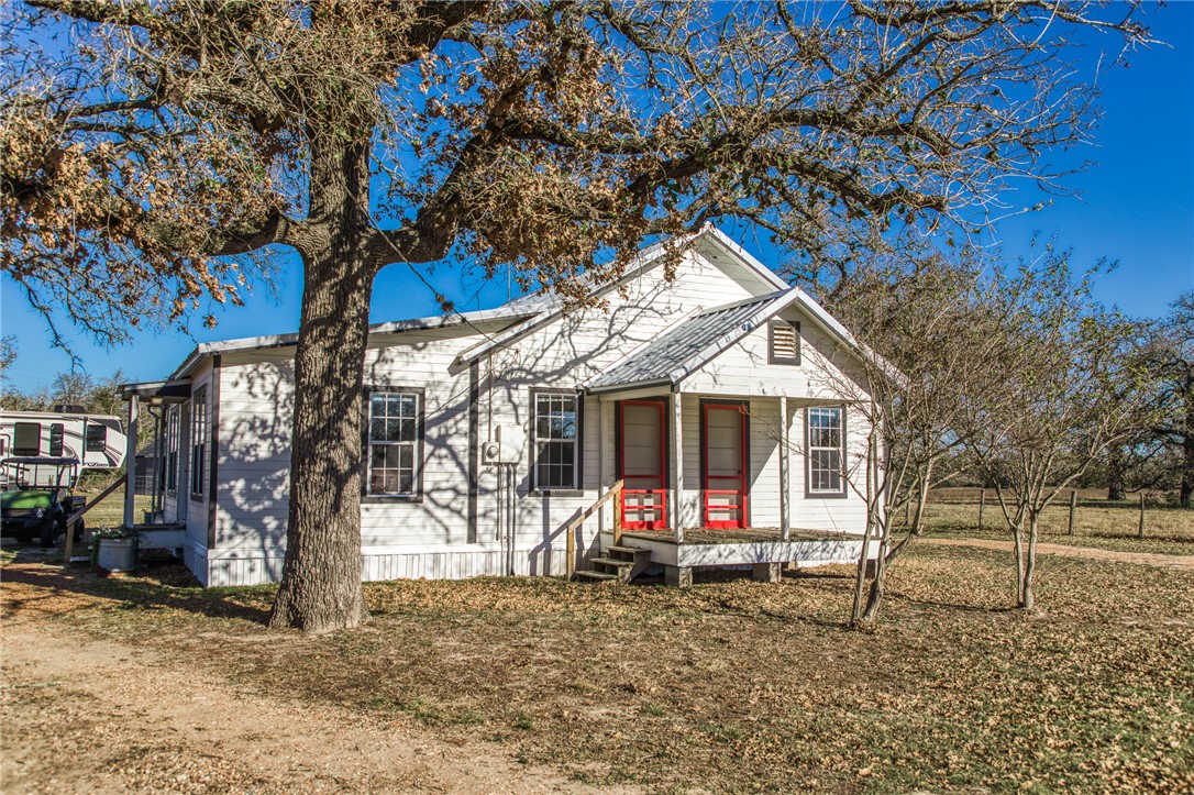 9354 Farm To Market 2780 Burton, TX 77835 - Photo 4 of 43 a view of a house with a yard and wooden fence