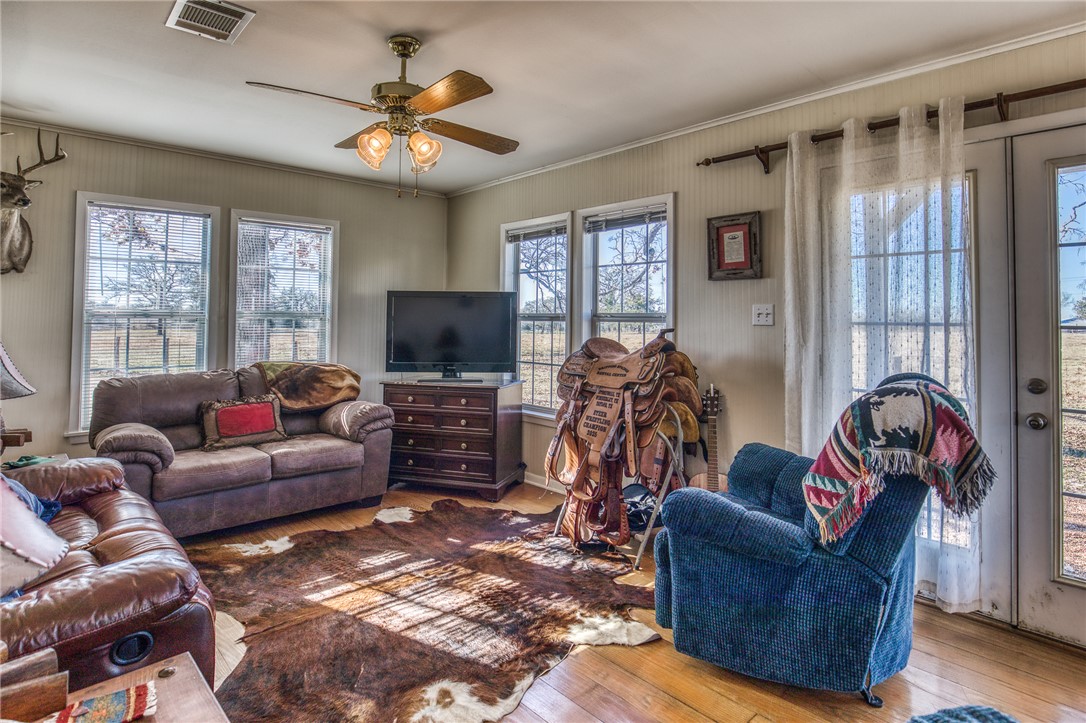 9354 Farm To Market 2780 Burton, TX 77835 - Photo 7 of 43 a living room with furniture and a flat screen tv