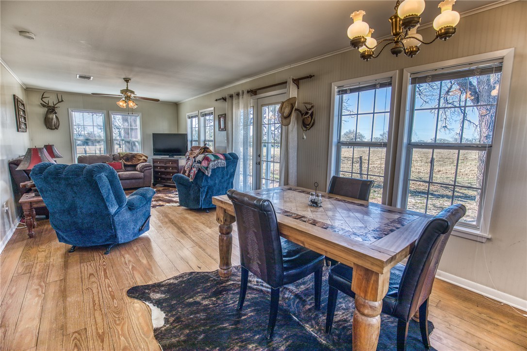 9354 Farm To Market 2780 Burton, TX 77835 - Photo 9 of 43 a view of a dining room with furniture window and wooden floor