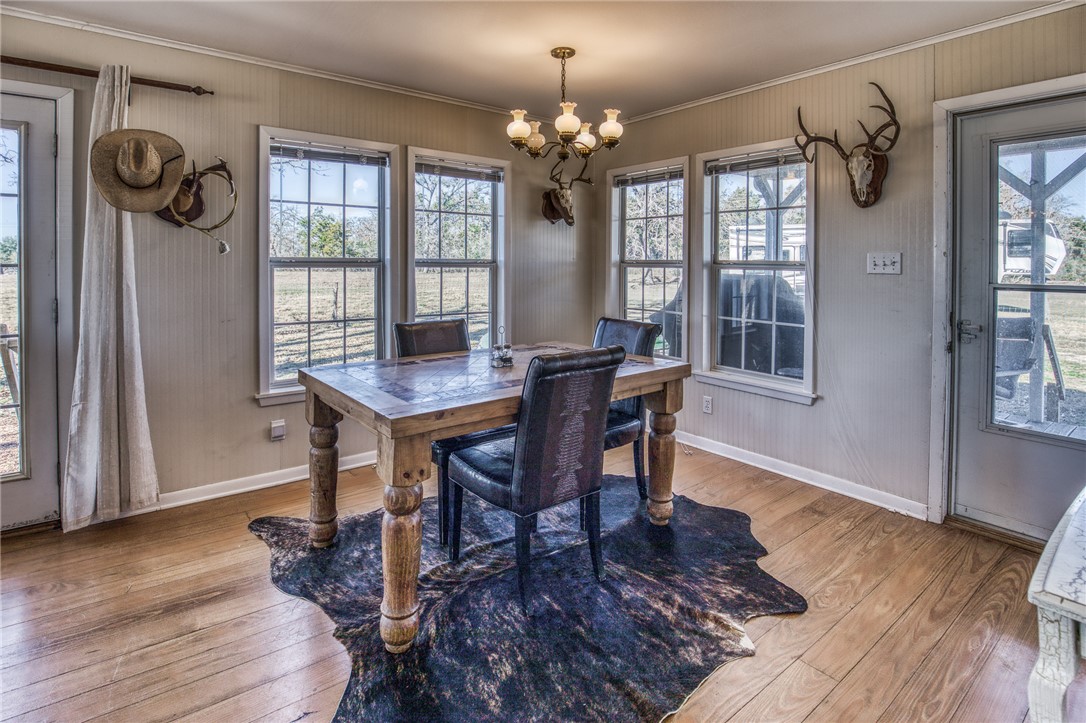 9354 Farm To Market 2780 Burton, TX 77835 - Photo 10 of 43 a view of a dining room with furniture window and wooden floor