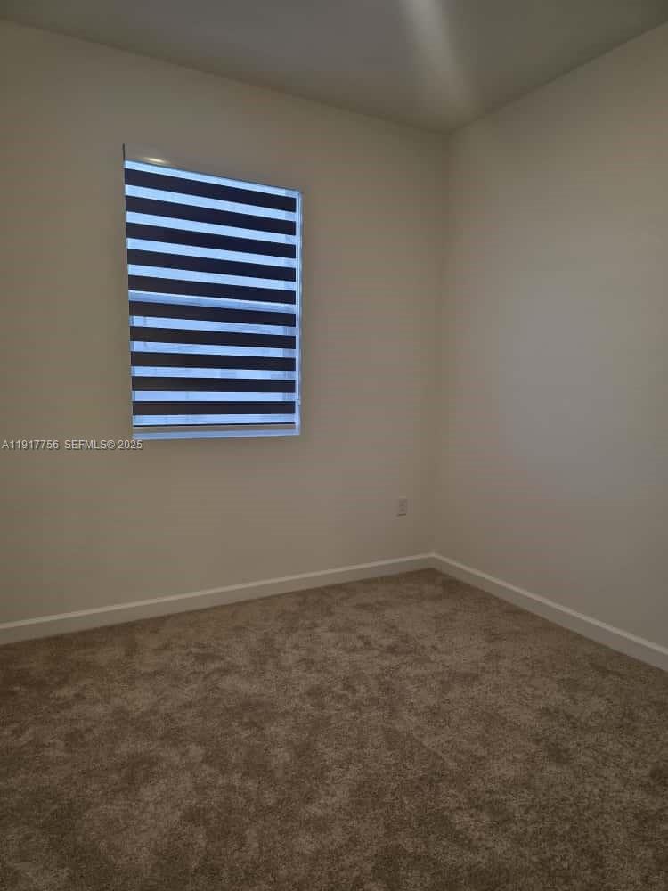 17875 Southwest 359 Terrace Homestead, FL 33034 - Photo 11 of 20 an empty room with a window