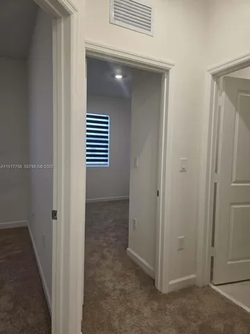 a view of a hallway with closet area
