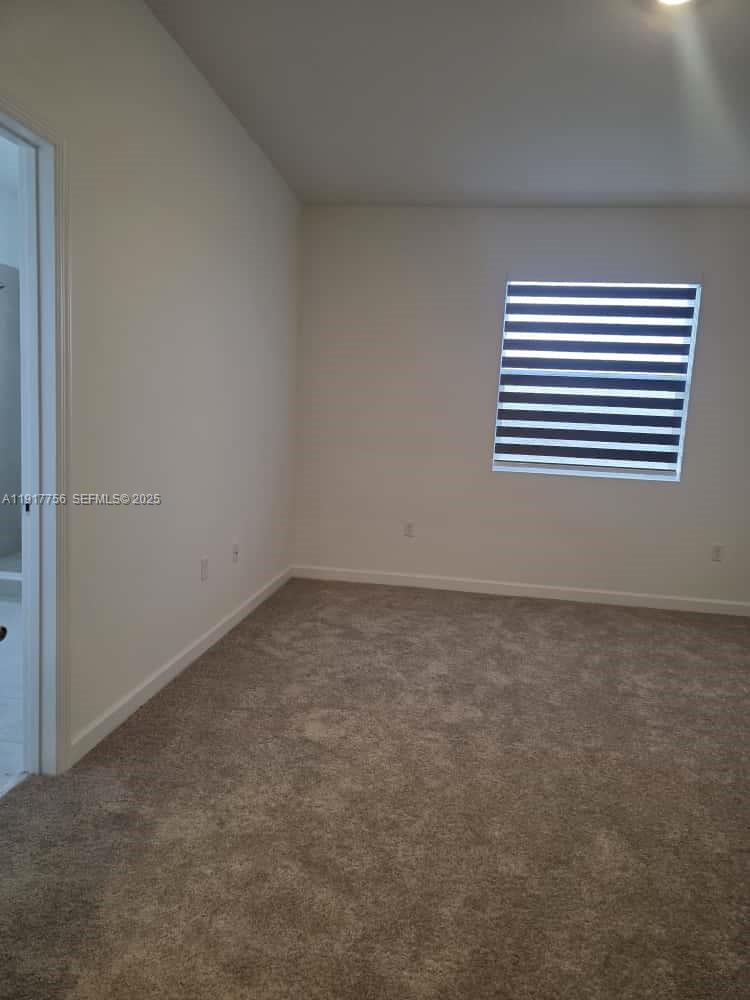 17875 Southwest 359 Terrace Homestead, FL 33034 - Photo 17 of 20 an empty room with a window