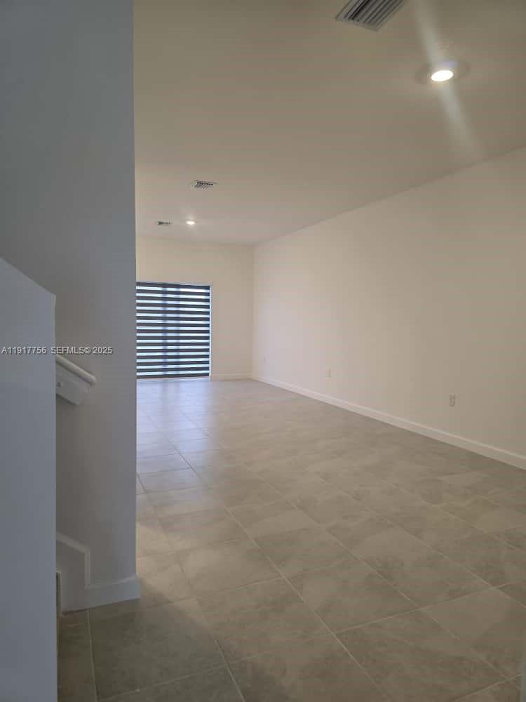 17875 Southwest 359 Terrace Homestead, FL 33034 - Photo 3 of 20 a view of an empty room with a window